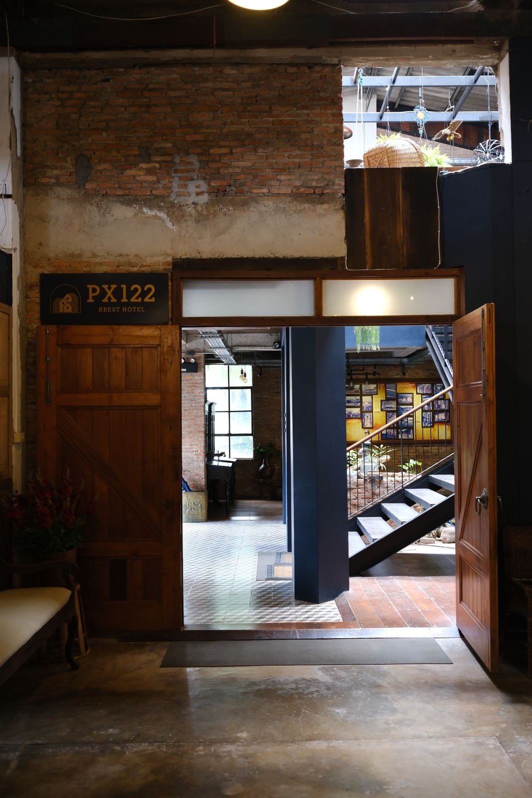 Heavy timber doors opening onto the courtyard