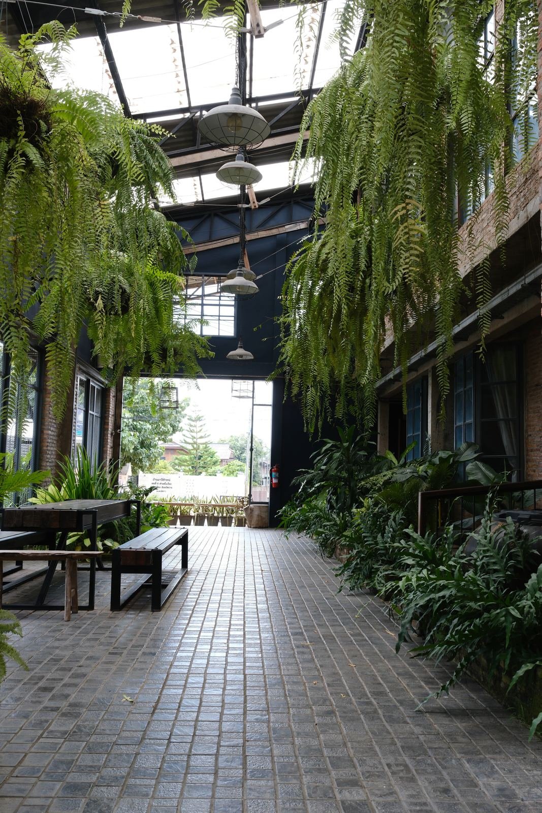 Brick-paved walk through the garden toward the street